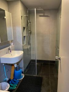 a bathroom with a shower and a sink at LW Suite at JQ Seaview 2BR High Floor & Wi-Fi in Kota Kinabalu