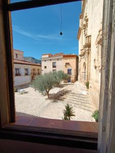 a view of a courtyard from a window at Casa Rural Moliner in Las Cuevas de Cañart