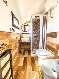 a bathroom with a toilet and a sink at Helianthus rooms in Pula
