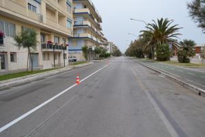 an empty street with orange cones in the middle at Hellorooms in Pescara +23 photos