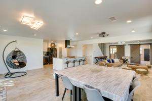 a kitchen and living room with a large table and chairs at Patios and Lake View McKinney Ranch Home! in McKinney