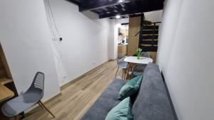 a living room with a couch and a table at Apartment in Bogota, Modelia, Airport in Bogotá