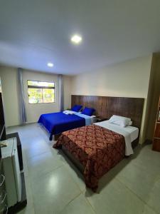Postel nebo postele na pokoji v ubytování Hotel Villa