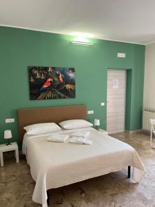Postel nebo postele na pokoji v ubytování B&B Casa Doria