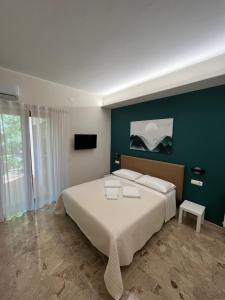 Postel nebo postele na pokoji v ubytování B&B Casa Doria