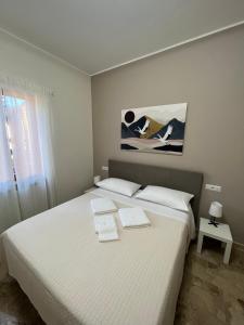Postel nebo postele na pokoji v ubytování B&B Casa Doria