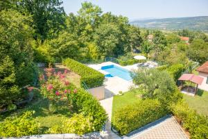 an aerial view of a garden with a swimming pool at Villa Luna in Imotski