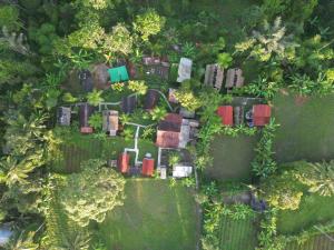 an overhead view of a house in a forest at Tetebatu Sama Sama Bungalows in Tetebatu