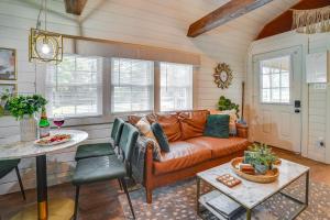 a living room with a couch and a table at Idyllic Camden Hideaway 1 Mi to Kentucky Lake in New Johnsonville