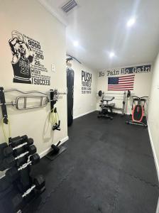 a gym with dumbbells and weights in a room at Private Suite with Private Gym&Patio, Minutes to Beaches, Up to 4 Guests in Largo