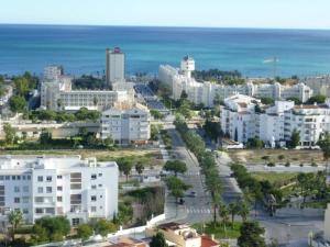 an aerial view of a city with buildings and the ocean at 0318 Studio in Torremolinos 800 m from the beach in Torremolinos