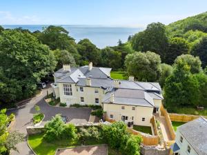 an aerial view of a large house with a yard at Captain's Retreat in Torquay
