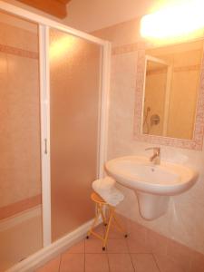 a bathroom with a sink and a shower at Hotel Montebaldina in San Zeno di Montagna