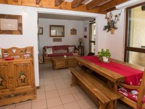 a living room with a table and a couch at Appartement Villard-de-Lans, 4 pièces, 8 personnes - FR-1-761-6 in Villard-de-Lans