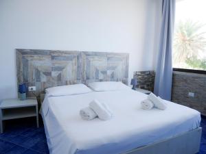 Postel nebo postele na pokoji v ubytování B&B Al Vecchio Pontile kitesurf