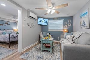 a living room with a couch and a bed at Downtown Dunedin Gem, Fully Renovated #3 in Dunedin