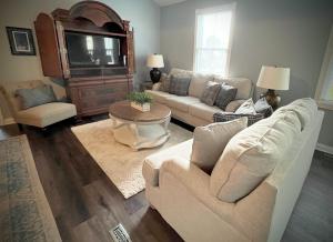 a living room with a couch and a tv at Cozy cottage near downtown Prescott in Prescott