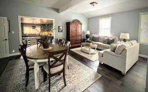 a living room with a table and a couch at Cozy cottage near downtown Prescott in Prescott