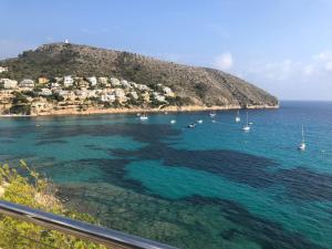 a view of a beach with boats in the water at Paraíso in Cumbre del Sol
