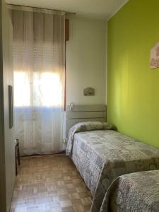 A bed or beds in a room at CASA FEDERICA