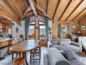 a living room with a table and a couch at Chalet familial cosy pour 8 pers. près des pistes et commodités à Courchevel Le Praz - FR-1-568-44 in Courchevel