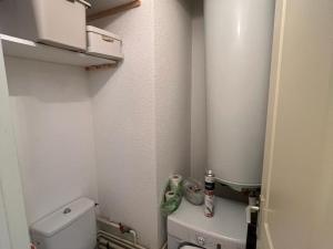 a small bathroom with a toilet in a room at Appartement Les Angles, 3 pièces, 6 personnes - FR-1-593-93 in Les Angles