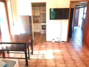 a living room with a table and a kitchen at L8 Street Apartments - Renningen in Renningen