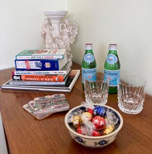 a table with a bowl of food and two soda bottles at Rocky Mountain View Bed & Breakfast in Cochrane