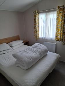 Postel nebo postele na pokoji v ubytování Sealgulls Rest