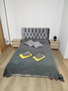 a bedroom with a bed with two pillows on it at Rami vieta visiems atvejams. in Vilnius