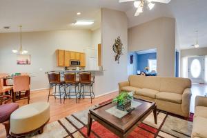 a living room with a couch and a table at Inviting Austell Home 14 Mi to Downtown Atlanta! in Austell