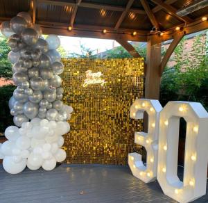 a group of balloons and a sign that says ego at Hendham House in Manchester