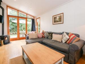 a living room with a couch and a coffee table at Hambleton in Cottesmore