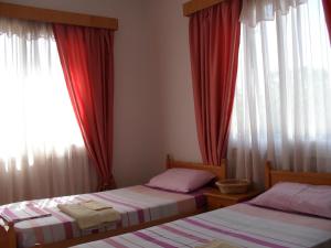 Ένα ή περισσότερα κρεβάτια σε δωμάτιο στο Βίλα Θεοδώρα