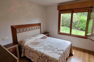 מיטה או מיטות בחדר ב-Ca' Fano - Tranquilidad en Gijón para 6/8 pax