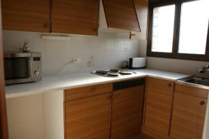 Kuchyňa alebo kuchynka v ubytovaní Emporium - apartamento