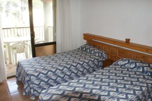 Posteľ alebo postele v izbe v ubytovaní Emporium - apartamento