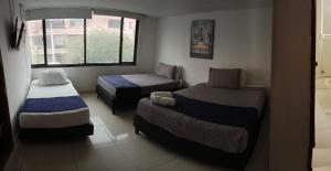 Ένα ή περισσότερα κρεβάτια σε δωμάτιο στο Hotel AG Boutique +12 φωτογραφίες