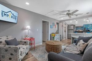 a living room with two couches and a kitchen at Downtown Dunedin Gem, Fully Renovated #4 in Dunedin