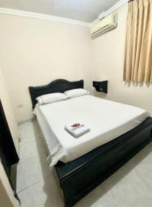 Cama o camas de una habitación en HOTEL BUENA VISTA