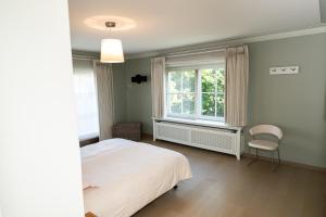 Postel nebo postele na pokoji v ubytování De Boter Villa