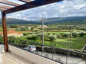 a view from the balcony of a house with a car at Casa Romã in Vale de Azares