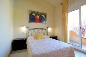 A bed or beds in a room at TARRACO 15 (BOLLERIA)