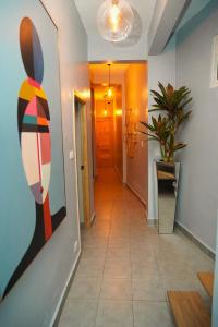a hallway with a painting of a rabbit on the wall at Hostal 53 Boutique Santo Domingo in Santo Domingo