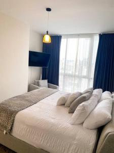 A bed or beds in a room at Hospédate y obtén una experiencia de lujo en el Yoo tower