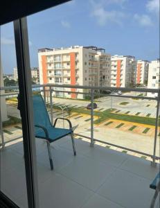 a blue chair sitting on top of a balcony at Sweet home in Punta Cana