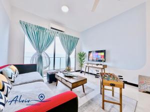 a living room with a couch and a table at Silverscape - Luxury 3-4BR with Bathtub I 6-11pax I Infinity Pool I JonkerSt - Managed by Alviv Homestay in Melaka