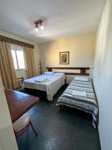 מיטה או מיטות בחדר ב-Suíte no centro de Angra dos Reis - 13