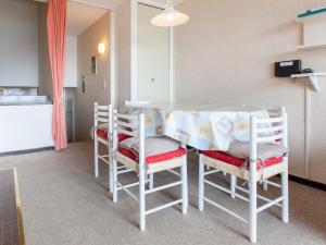 a dining room table with chairs and a table with at Appartement Avoriaz, 3 pièces, 7 personnes - FR-1-314-204 in Morzine