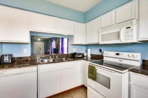 a kitchen with white cabinets and a sink at 2 Mi to Epperson Lagoon Home with Private Yard in Wesley Chapel